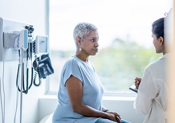 Patient seeing a cardiologist to get their heart checked. 