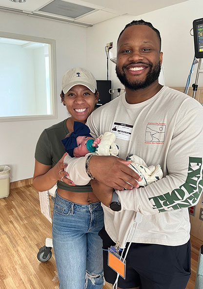 Kierra and Delmas Hoye holding their new baby girl, Raya