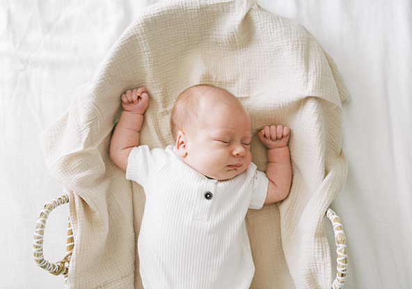 Baby Thierry Kobes is sleeping in a newborn portrait